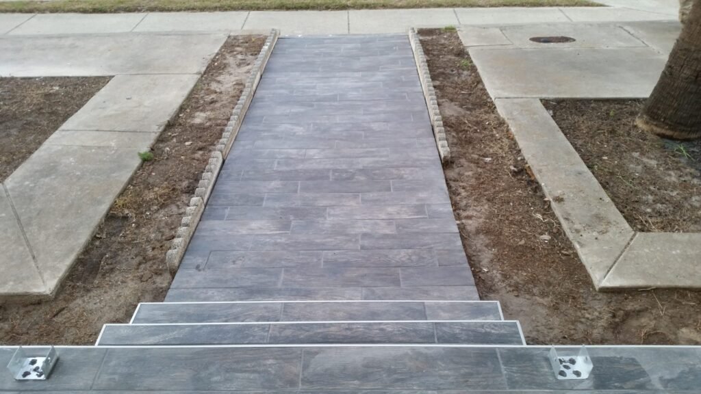 Front walkway and steps finished in wood-look tile