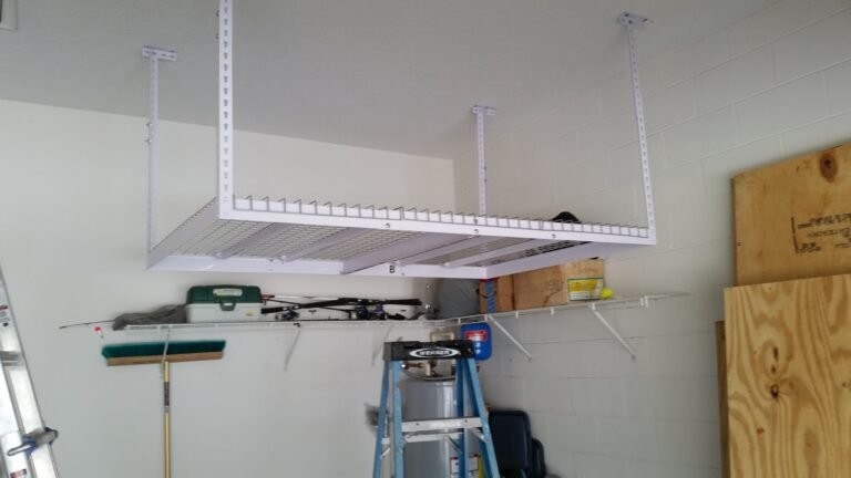 Overhead storage rack being installed on a garage ceiling