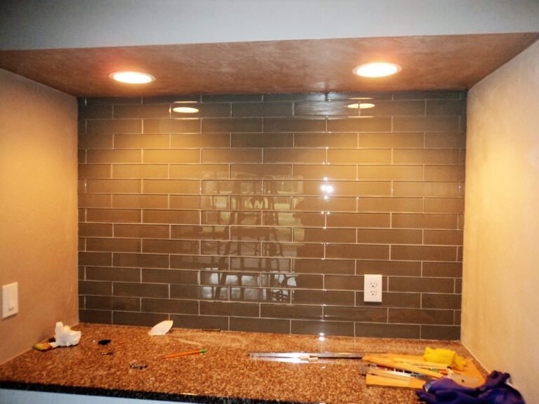 Close-up of a glass subway tile backsplash