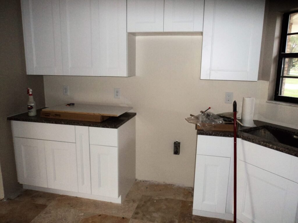 Kitchen with new cabinets before the backsplash was installed