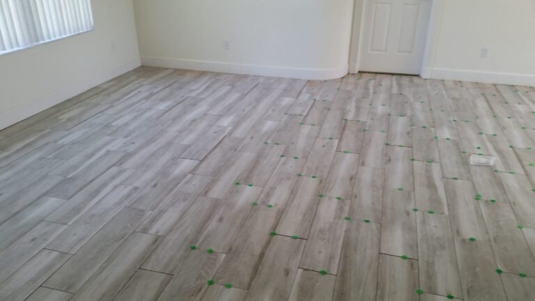 Living room finished with new wood-look plank tile flooring