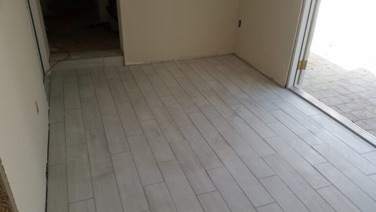 Room finished with light plank tile flooring